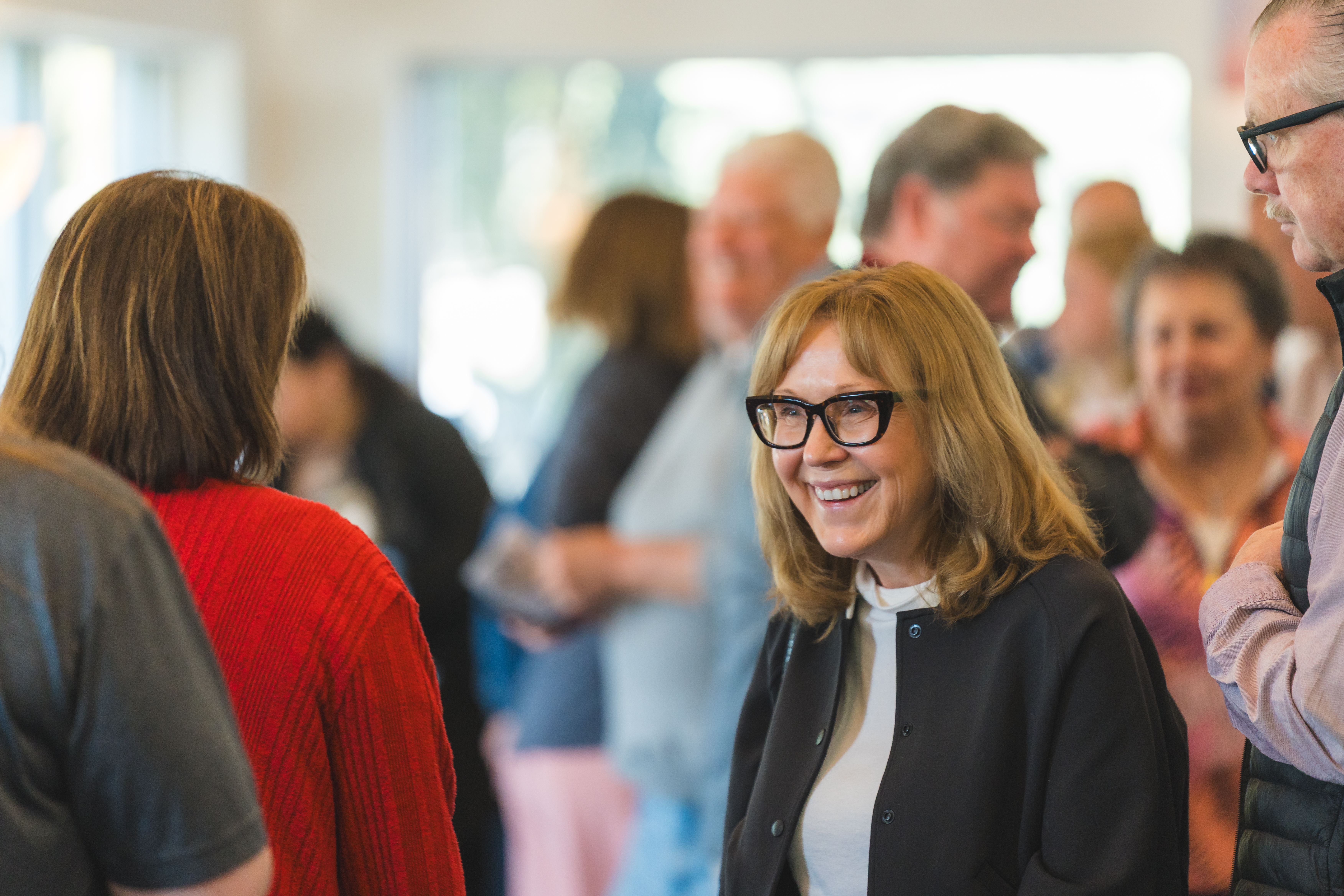 Woman smiling in church lobby