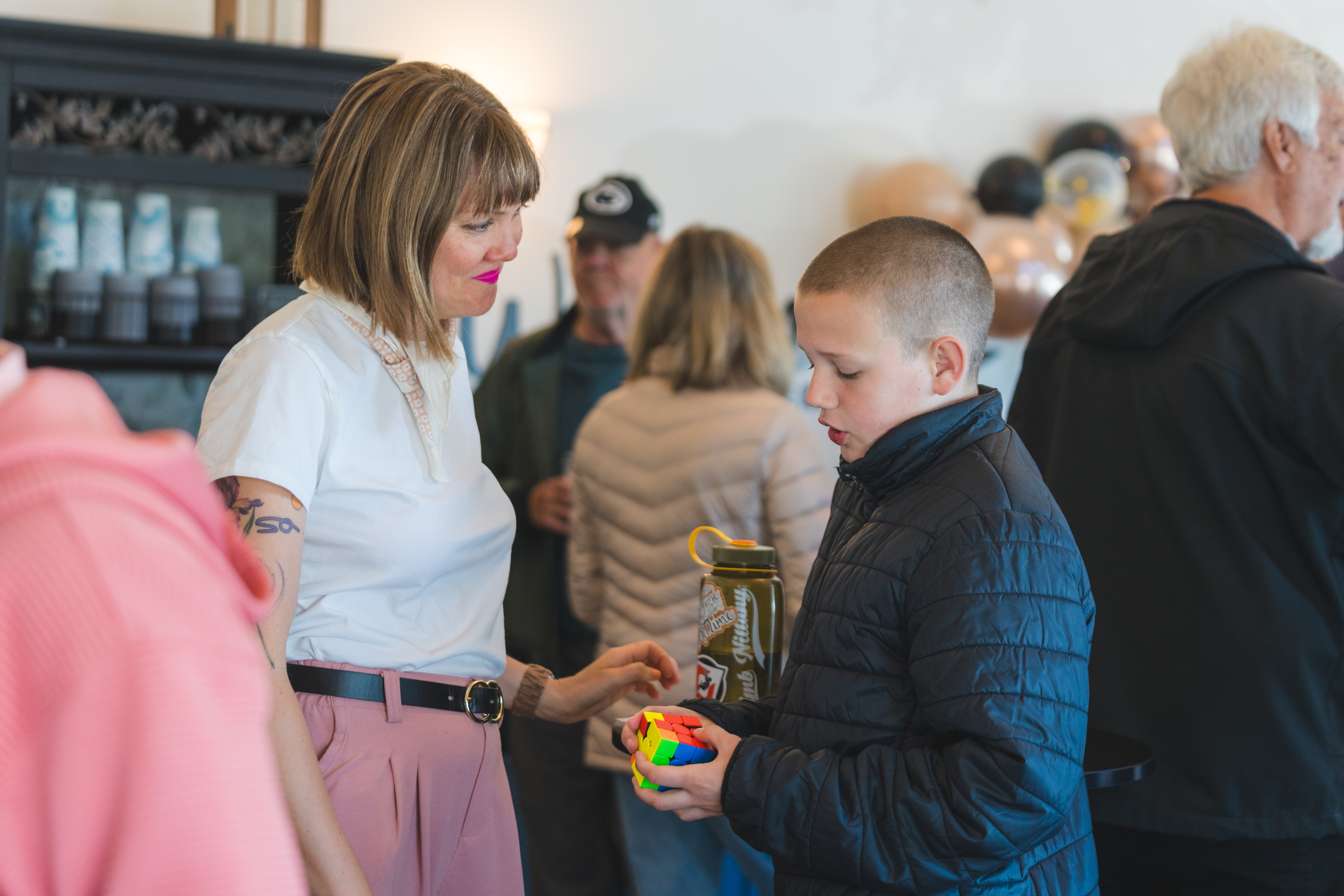 Mother and son talking in church lobby