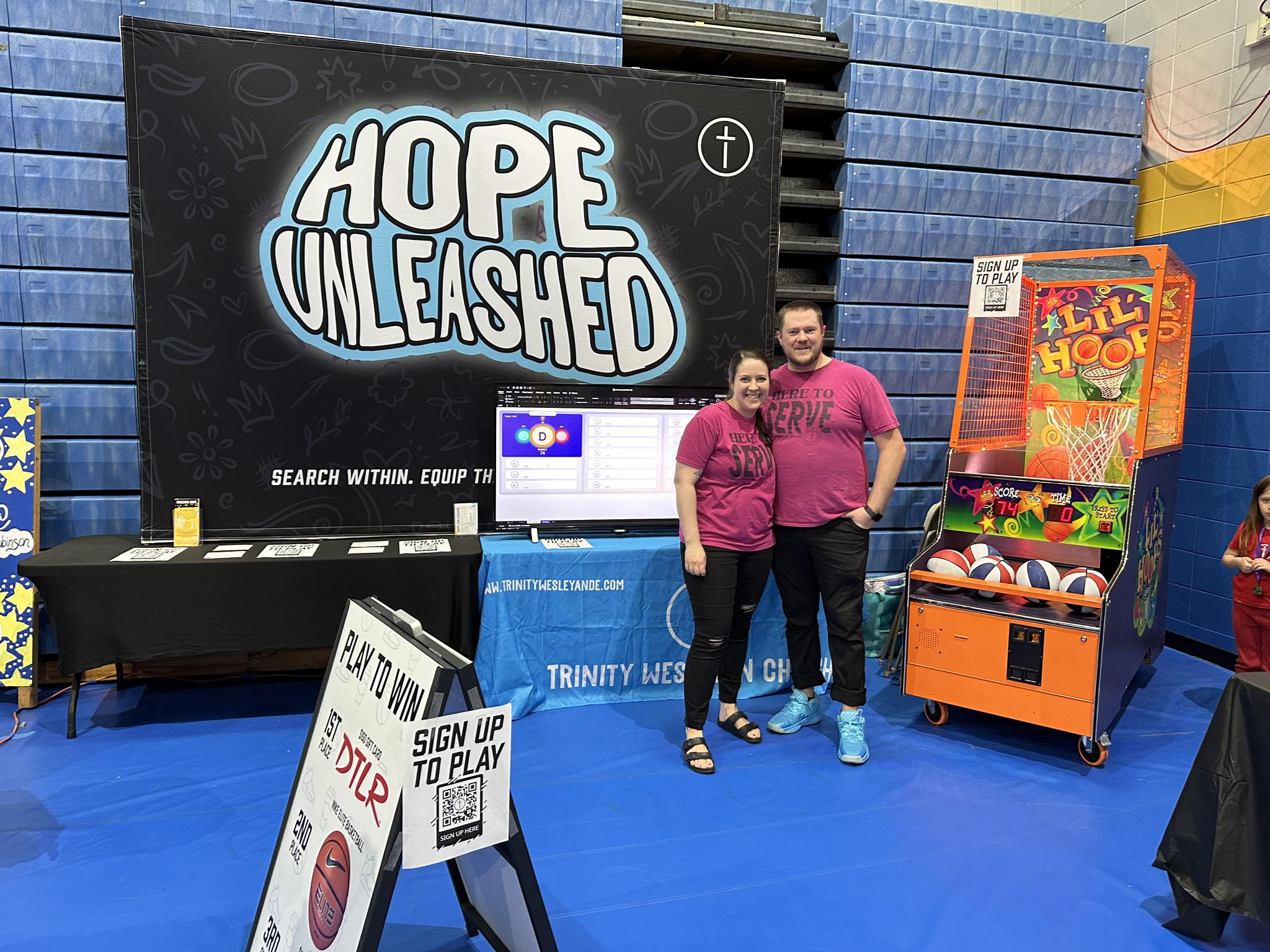 Pastors Aaron and Jennifer at Community Event]