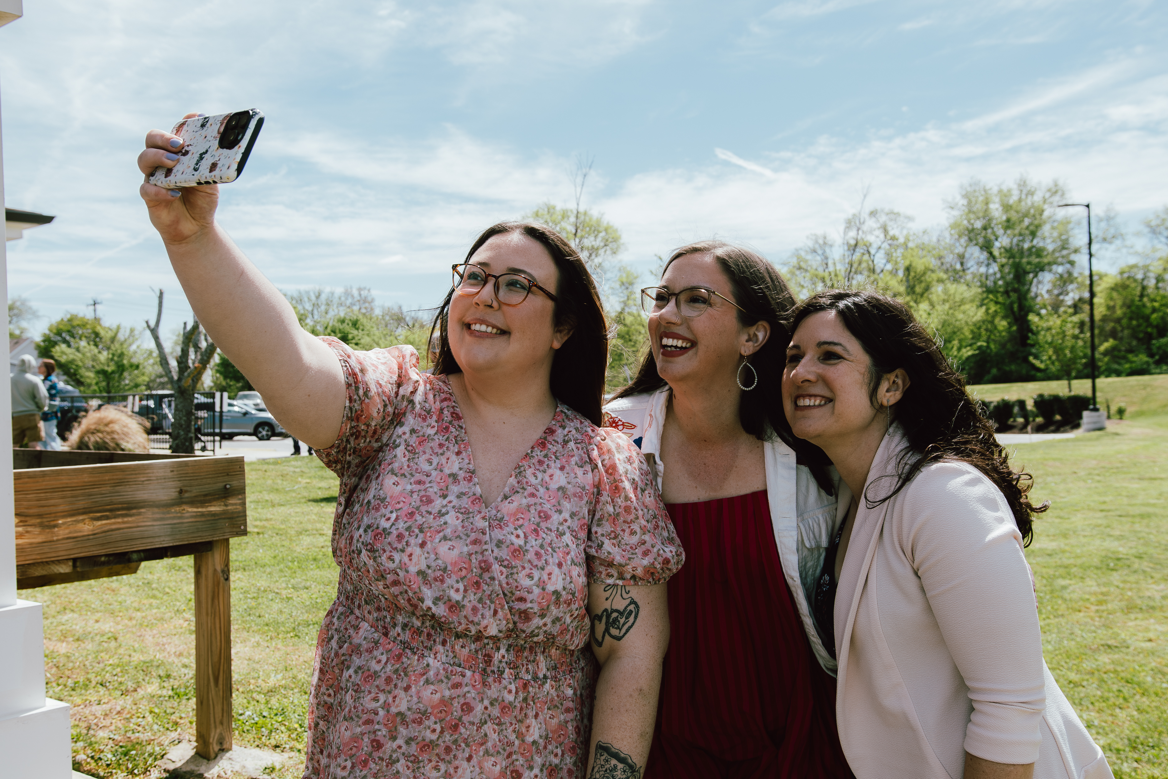 Three women smiling together while taking a selfie at Oasis Church in Hendersonville, Tennessee.