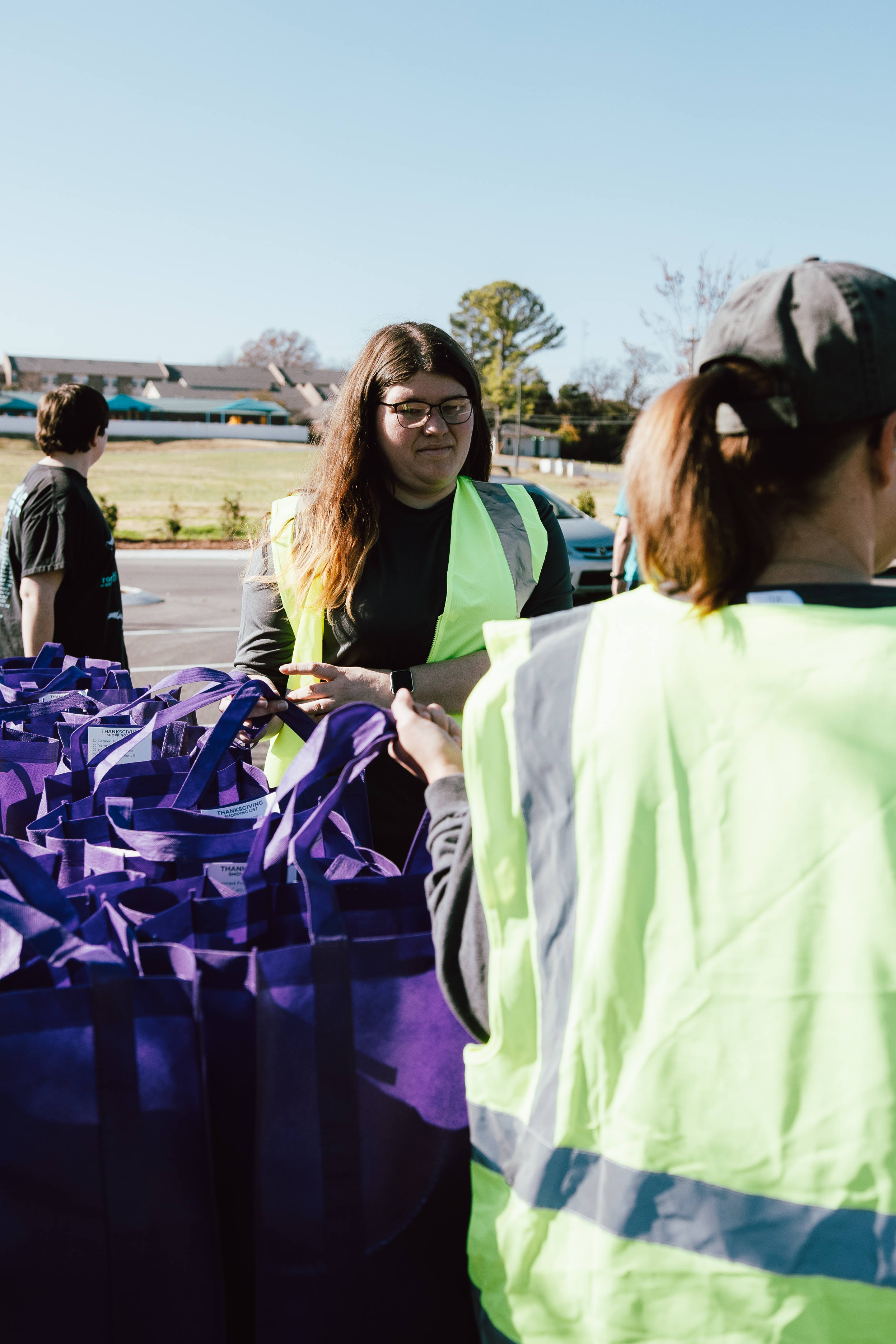 Oasis Church volunteers organizing Thanksgiving meal bags before the drive-through begins.