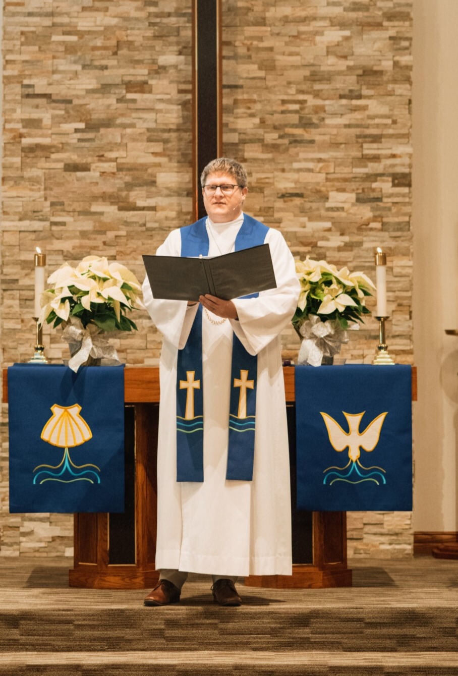 Pastor Backus addressing the congregation from the altar