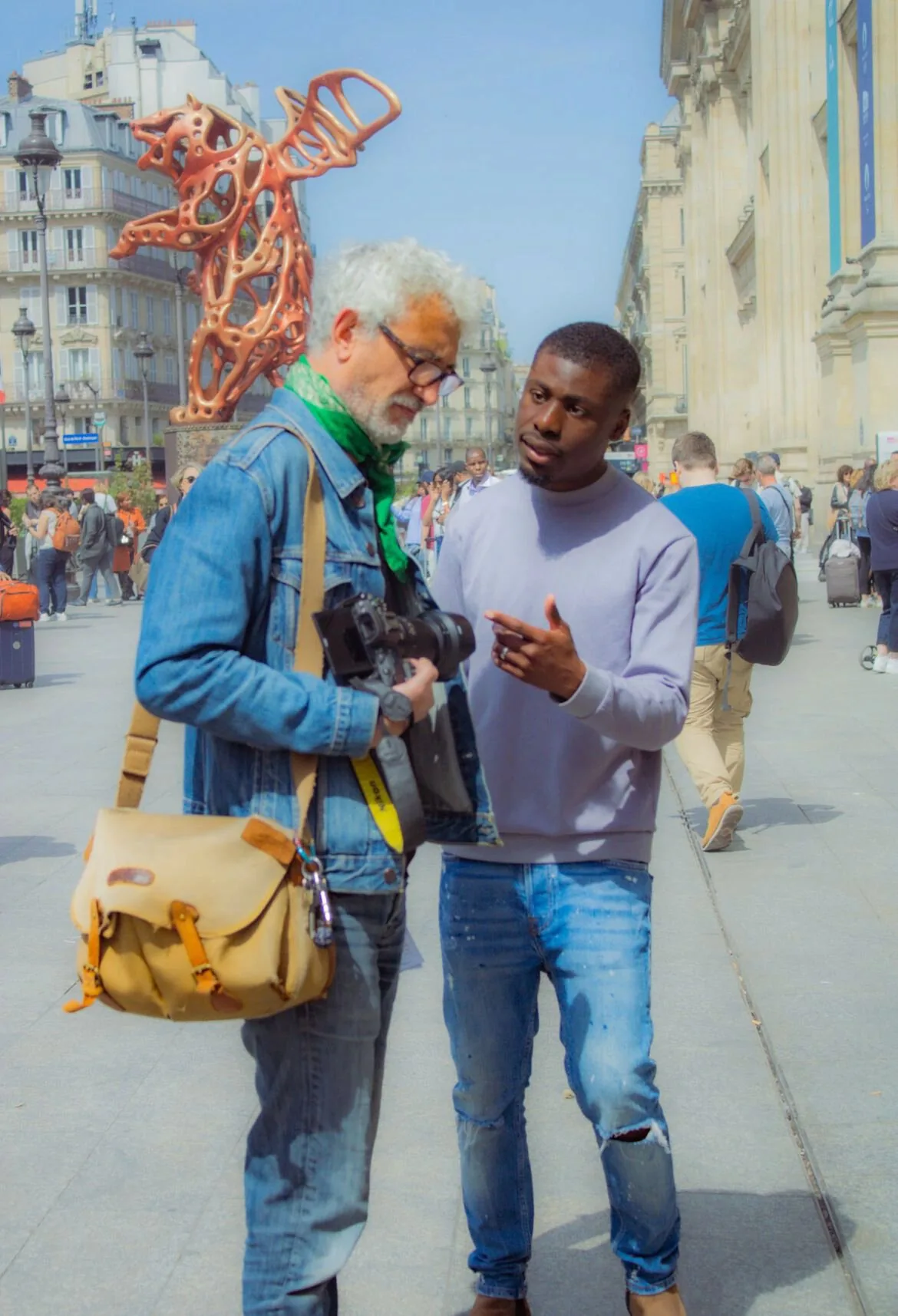 Two people talking in a Paris square.