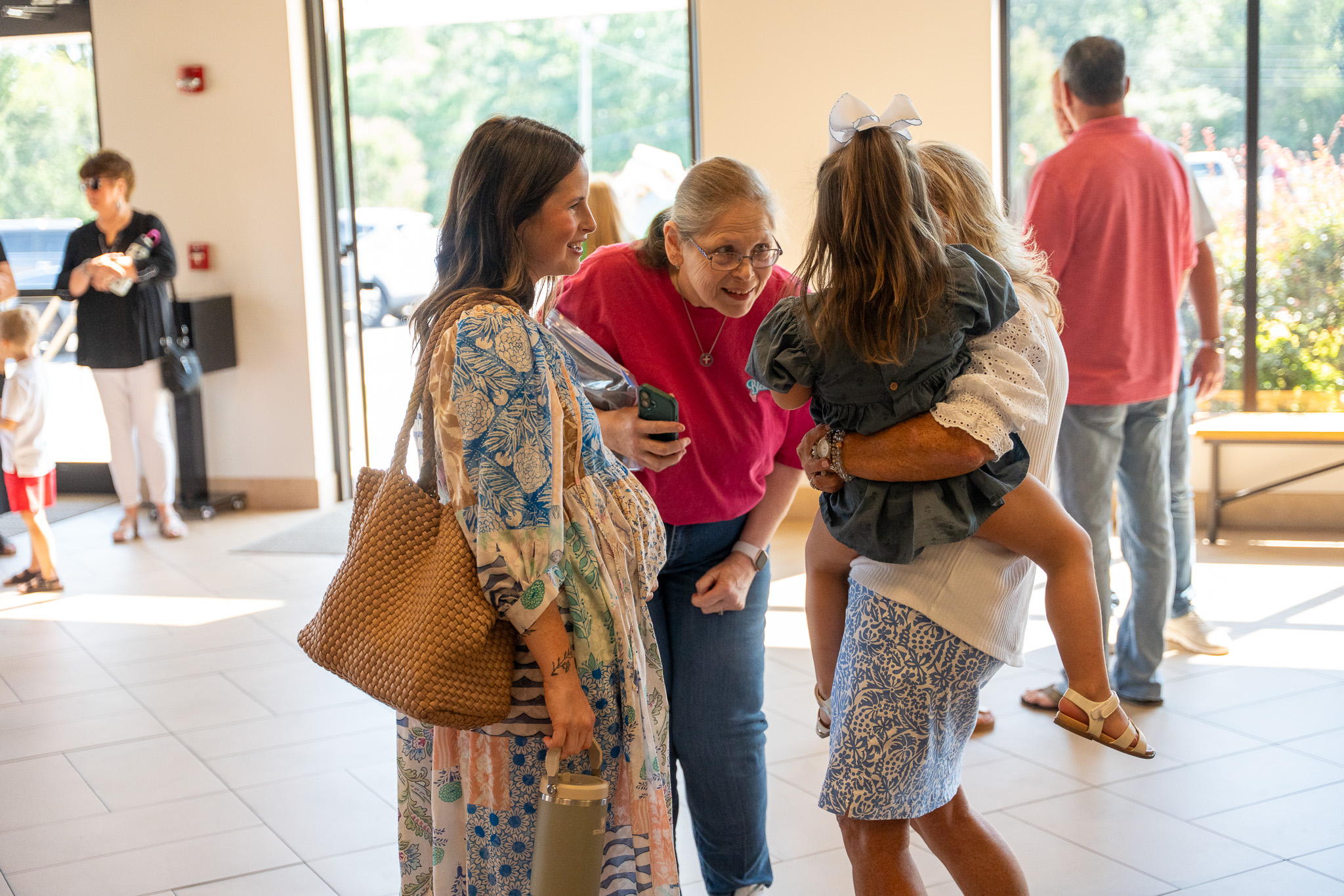 Families gathering in the church lobby