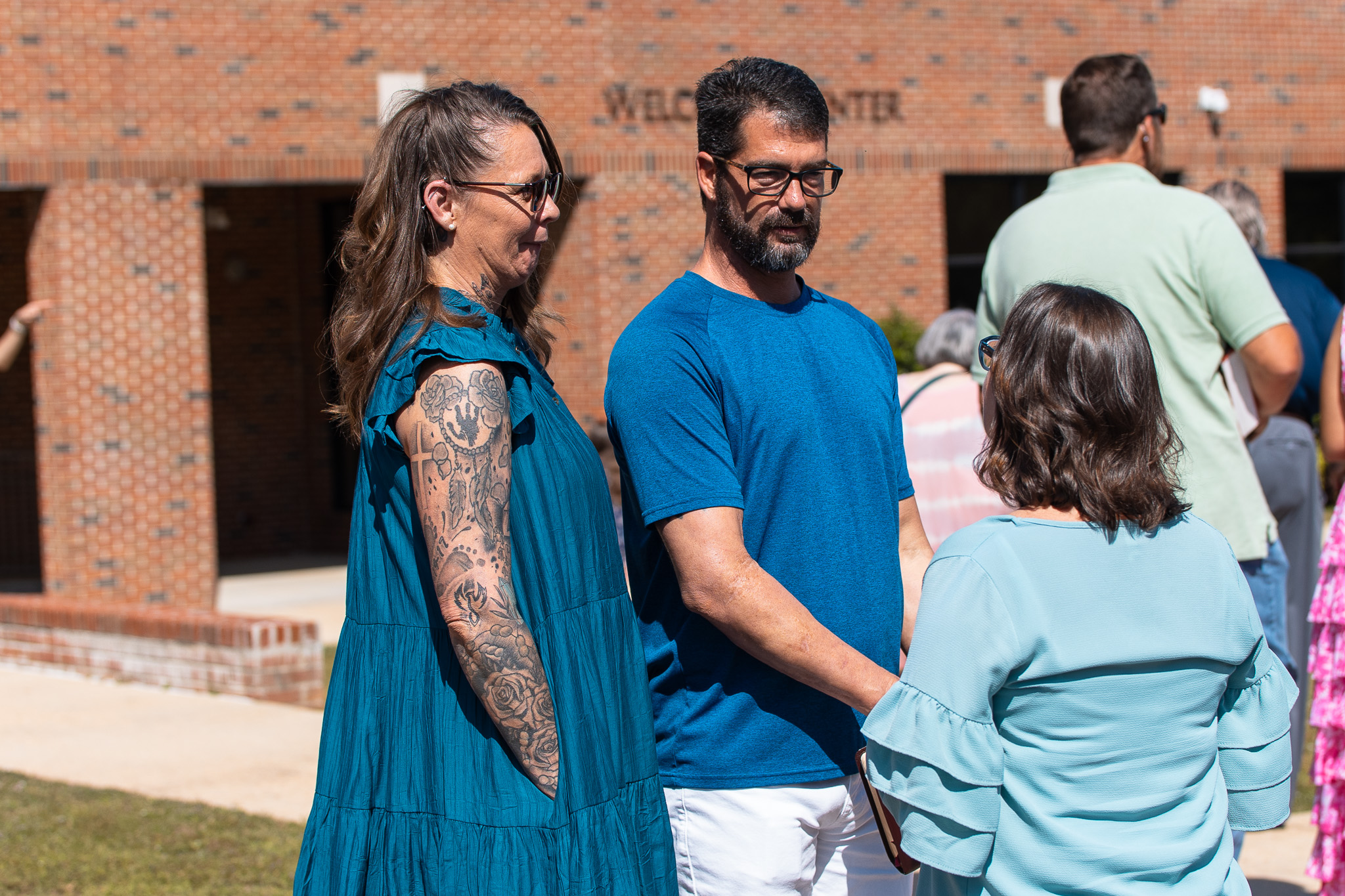 Church members talking together outside the building