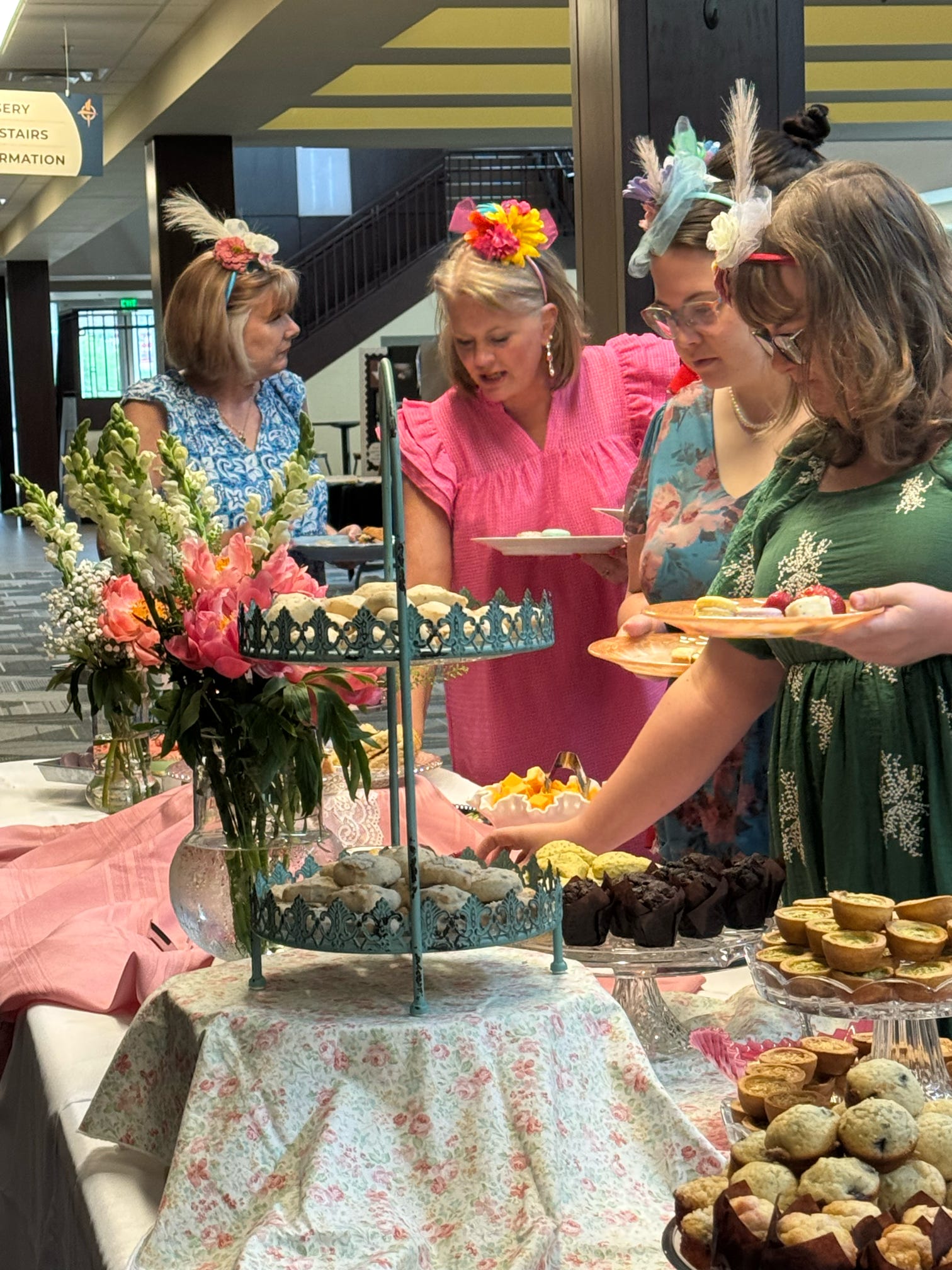 A young father with his toddler are hunting Easter eggs at our Egg-stra Special Egg Hunt.