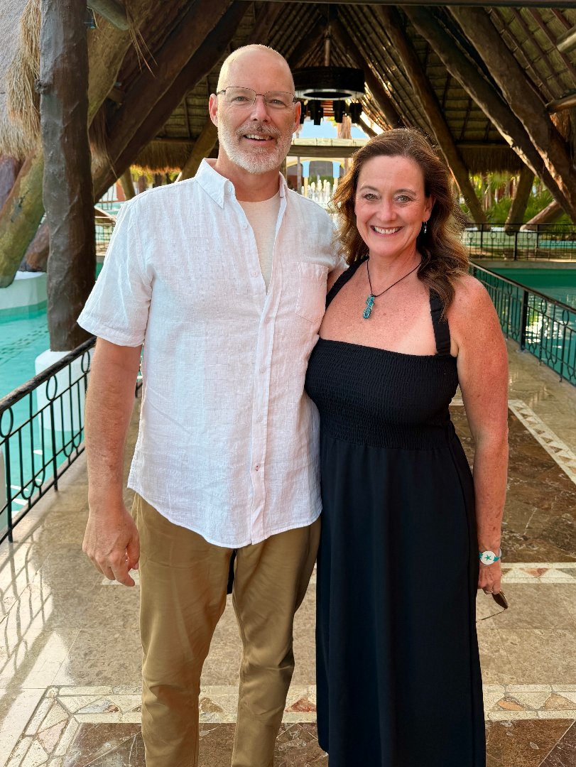 Couple standing on a bridge
