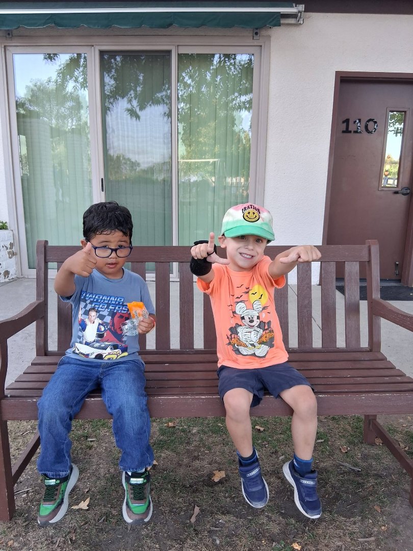 Two Children sitting on a bench
