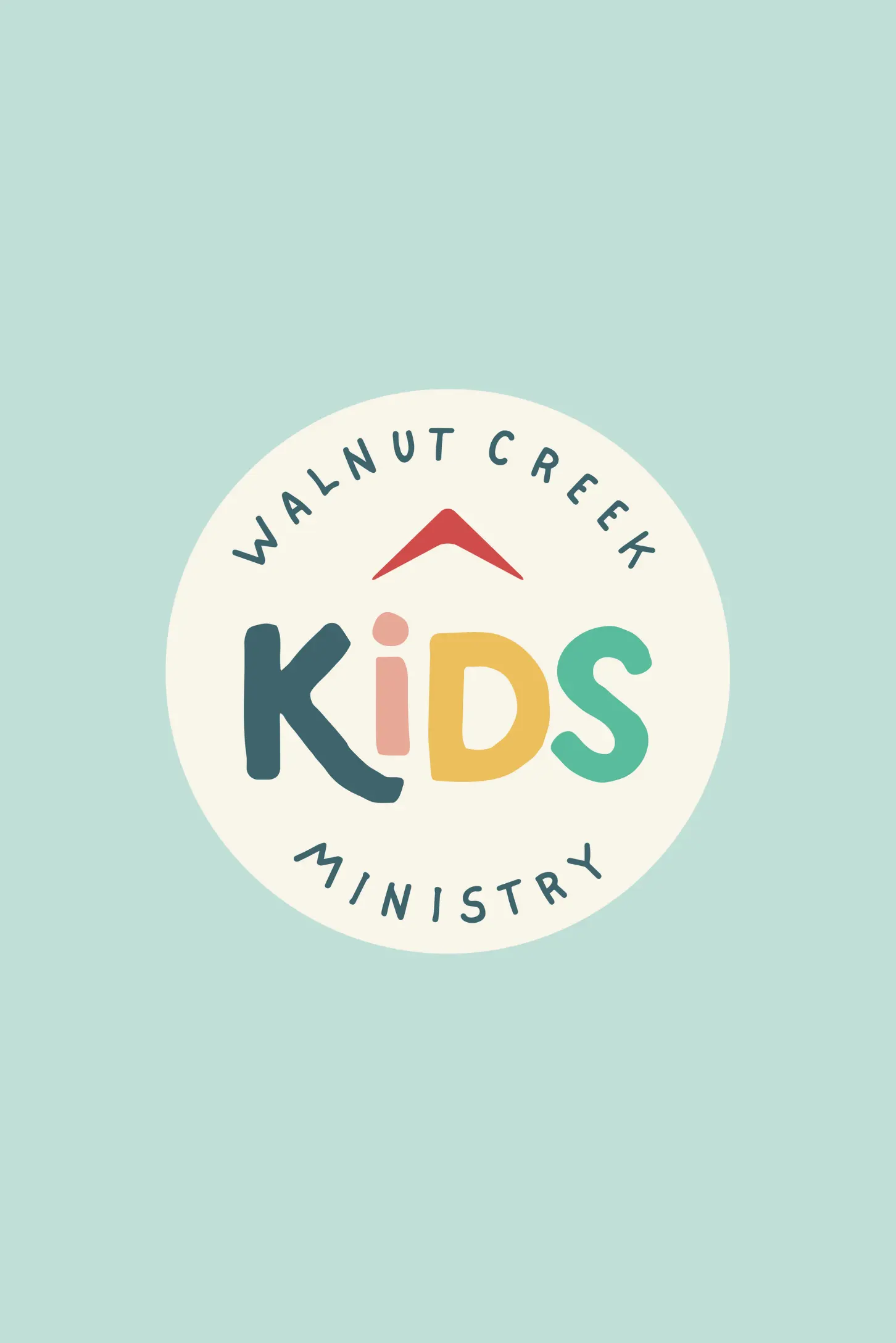 A playful logo for Walnut Creek Kids Ministry set against a light mint green background. The logo is contained within an off-white circle, featuring a small red chevron at the top. The word "KIDS" is written in large, rounded, multi-colored letters (dark teal, pink, yellow, and green), with the words "WALNUT CREEK" arched above and "MINISTRY" arched below in dark teal capital letters.