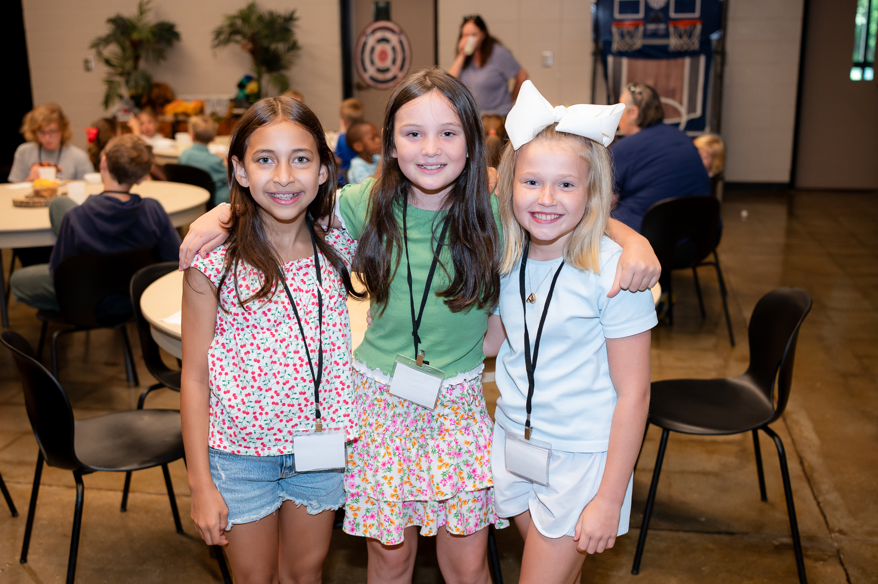 Three girls posing for a picture at VBS