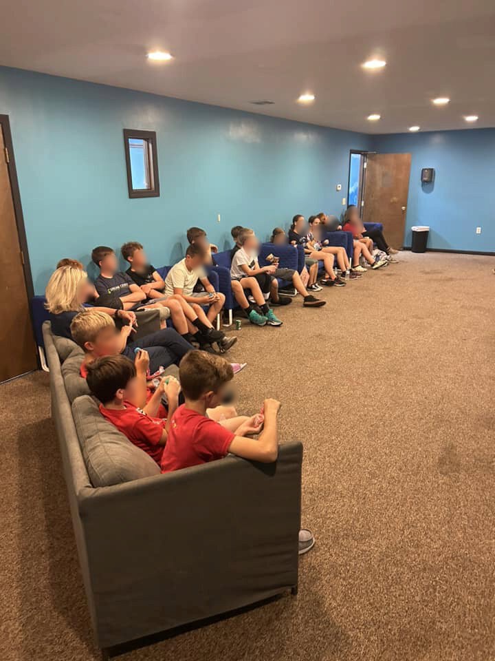 Youth gathered at Shelby Alliance Church, with faces blurred for privacy.