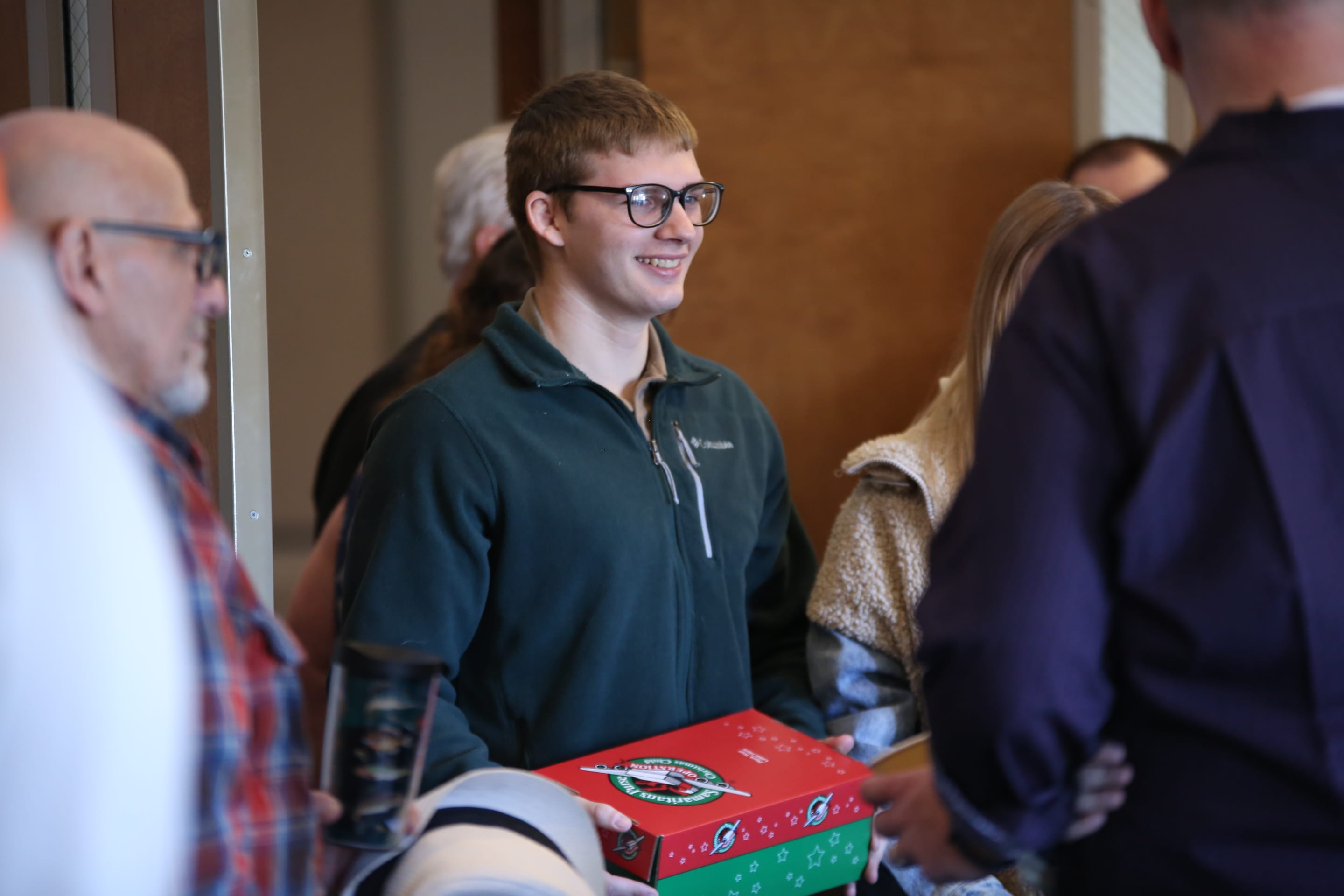 young man holding a box