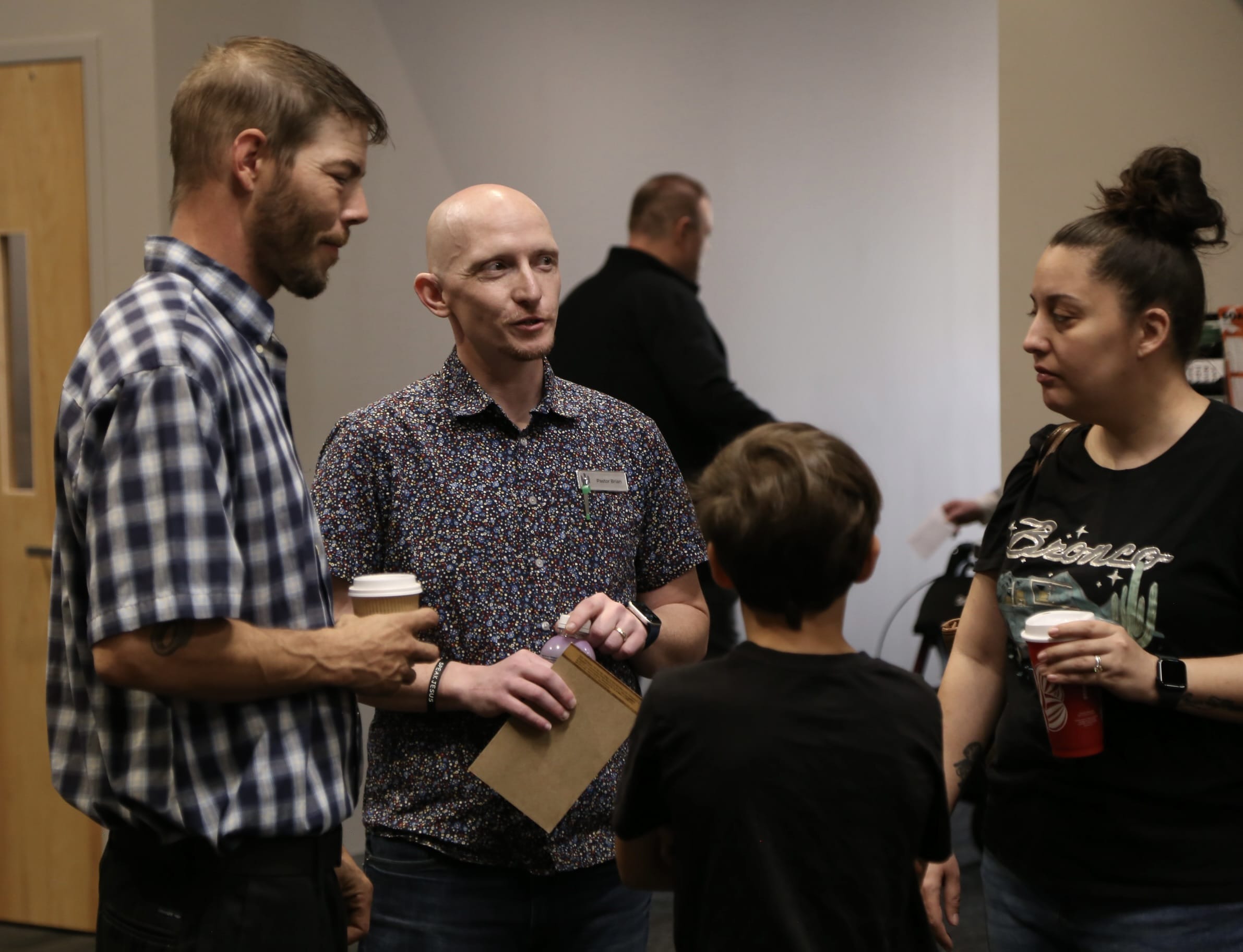 pastor and family chatting