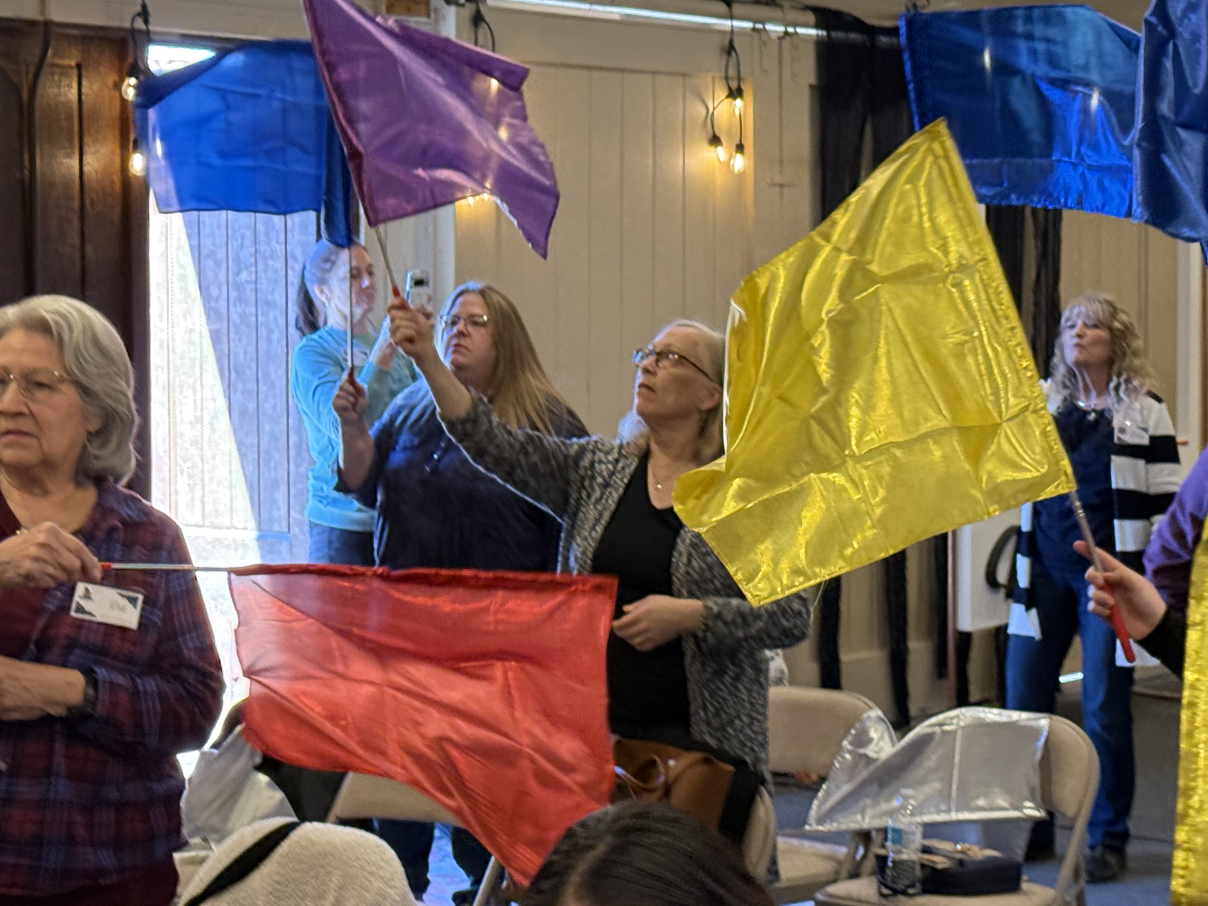 Women praising with flags at Women's Retreat