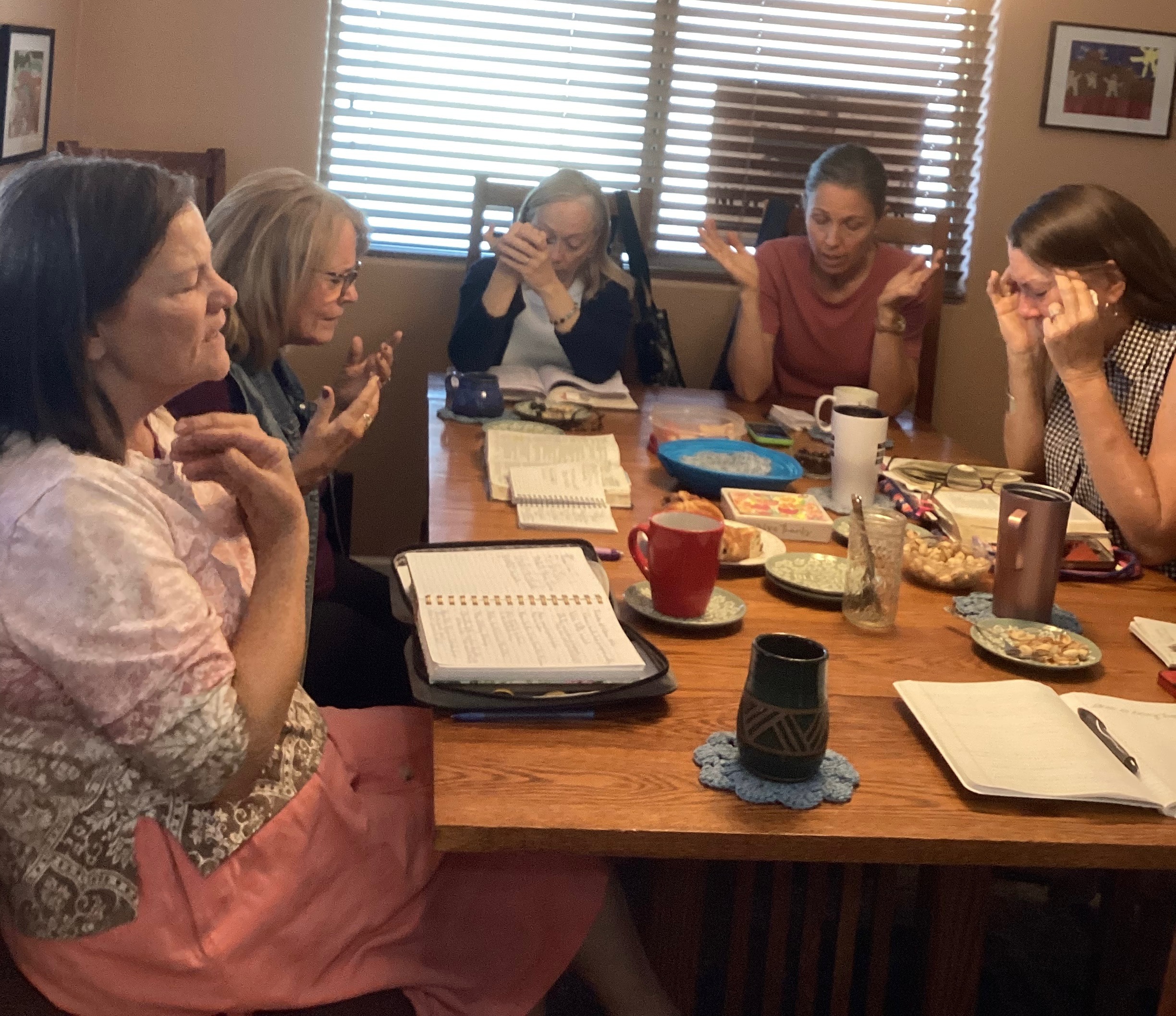 Women at a Table Praying