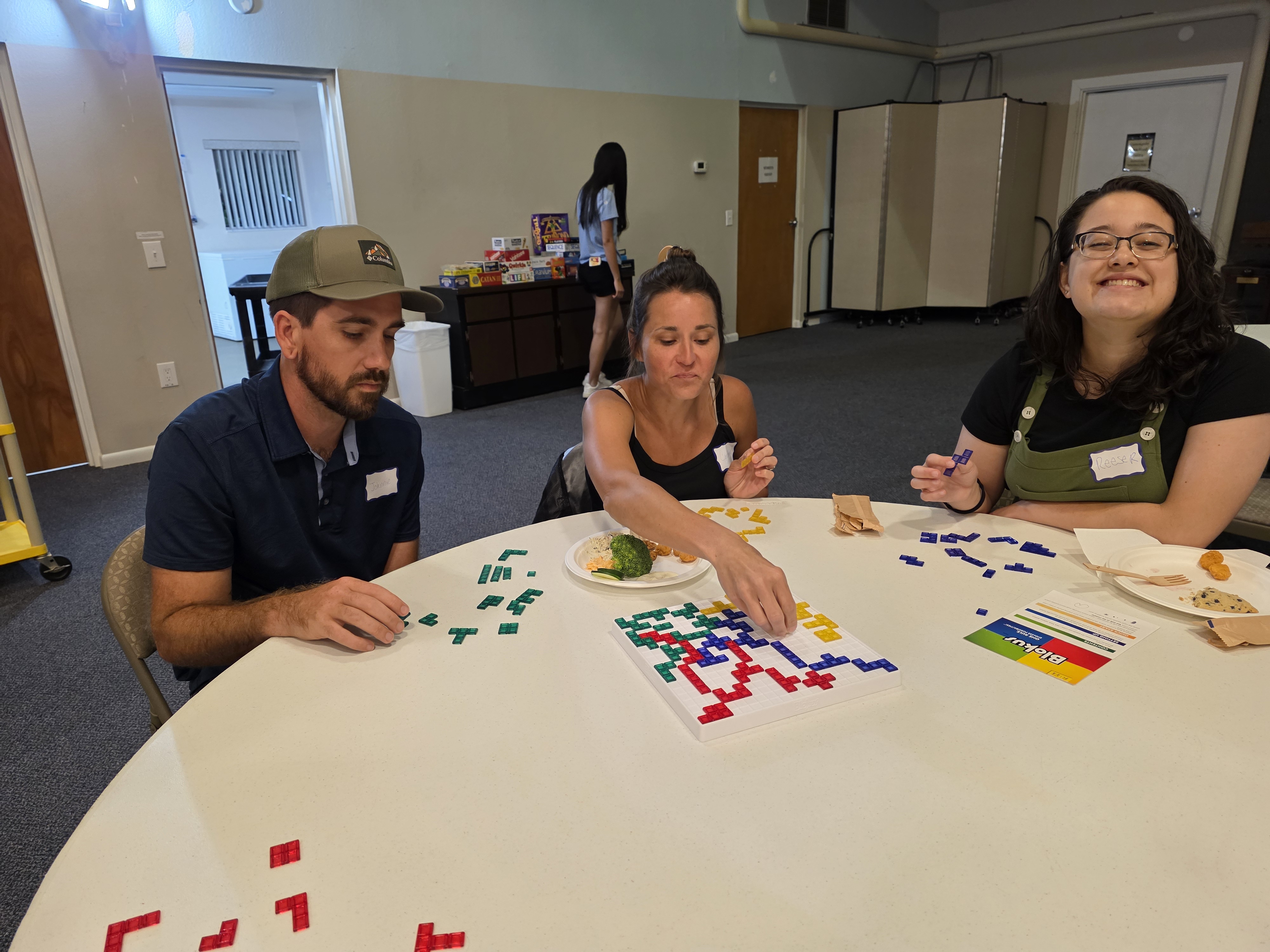 young adults playing a game at game night